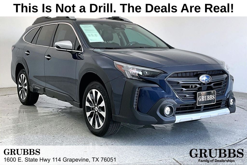 2023 Subaru Outback Touring in Cosmic Blue — front three-quarter view
