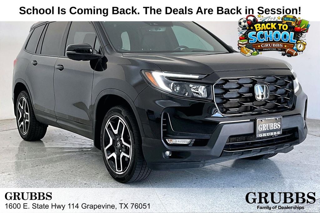 2023 Honda Passport Elite in Crystal Black Pearl — front three-quarter view