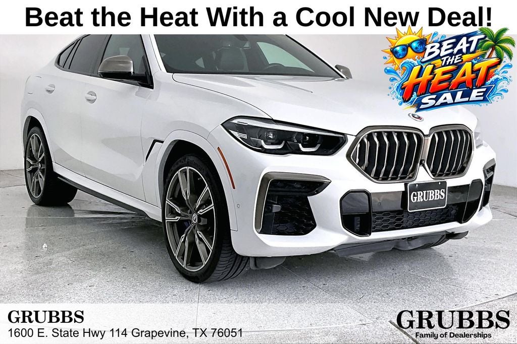 2022 BMW X6 M50i in Mineral White Metallic — front three-quarter view
