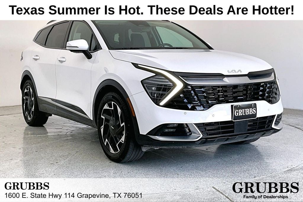 2025 Kia Sportage SX-Prestige in Glacial White Pearl — front three-quarter view