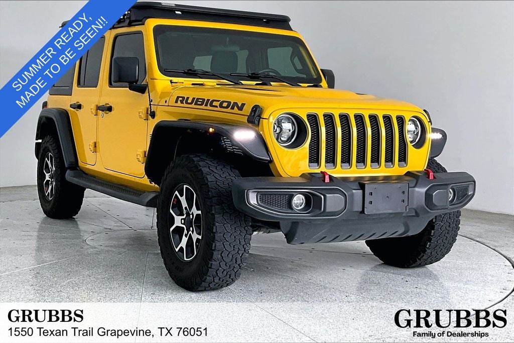 2021 Jeep Wrangler Unlimited Rubicon in Baja Yellow Clearcoat — front three-quarter view