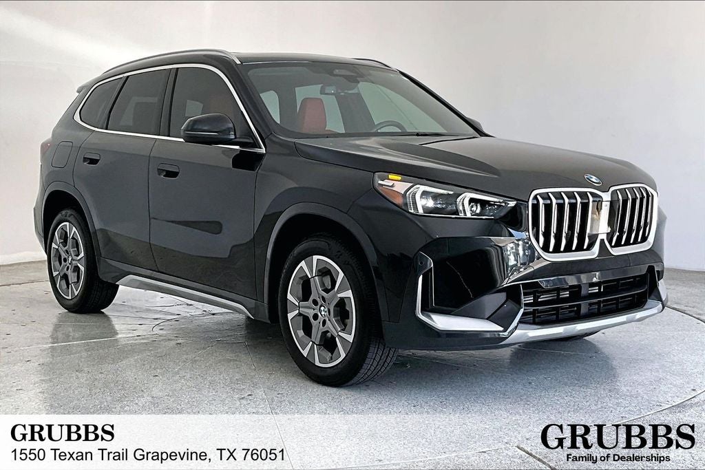 2025 BMW X1 xDrive28i in Black Sapphire Metallic — front three-quarter view